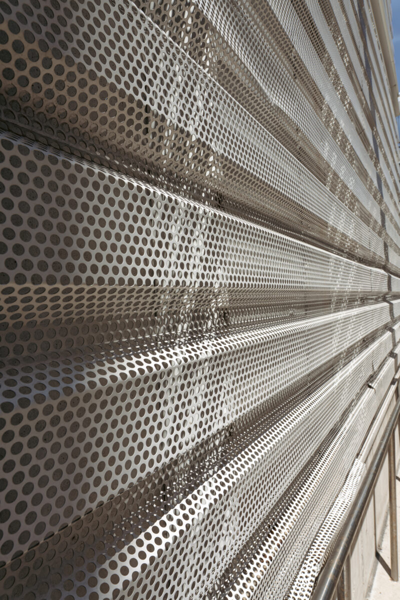 Perforated metal siding at Chicago Fashion Outlet