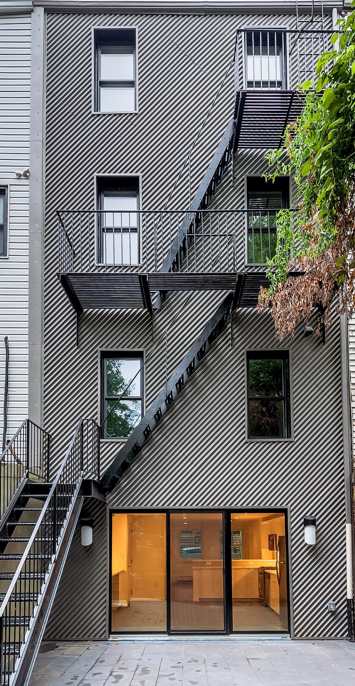 Sinewacve_Resituated_REAR Residence featuring sinewave panels